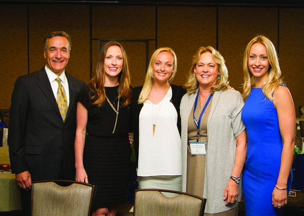 2016 Lucy Hobbs Award winner Dr. Pamela Schmidt (second from right) with her husband, Roger, and the couple’s three daughters, who were surprise attendees