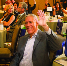 Guests hold ’em high for keynote speaker Libby Gill