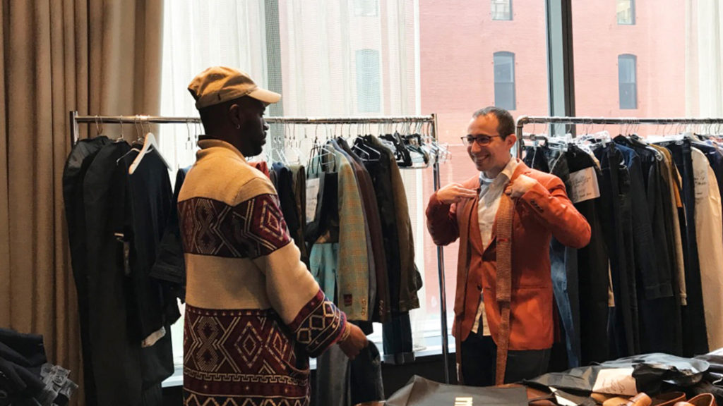 Dr. Peter Grieco (right) gets fitted in the finest fabrics