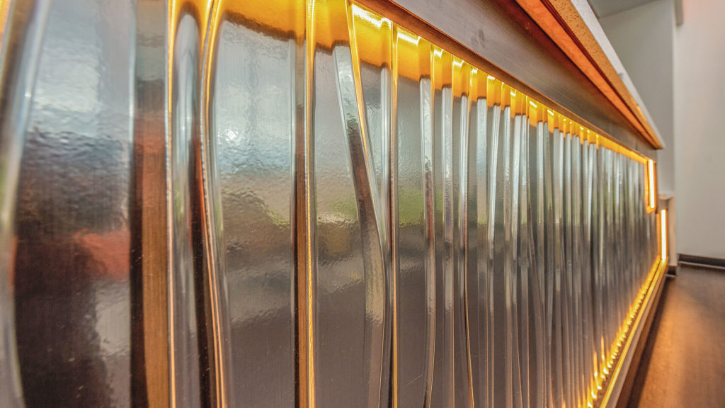 AMBER WAVES: The front, patient- facing portion of the main reception desk is a work of art in its own right. 