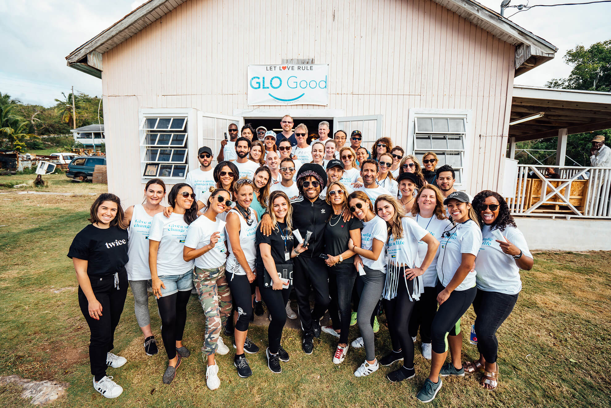 LET LOVE RULE: Rock star Lenny Kravitz (center) and the GLO Good dental team