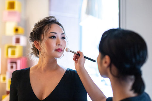 honoree Dr. BiNa Oh gets a makeup touch-up