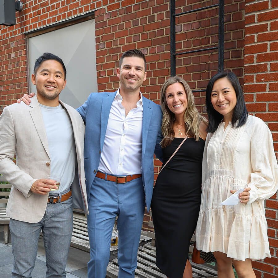 Dr. Russell Choy (left) and his wife, Dr. Annie Han (right), with Dr. Dean Chencharik and his wife, Rebecca Chencharik