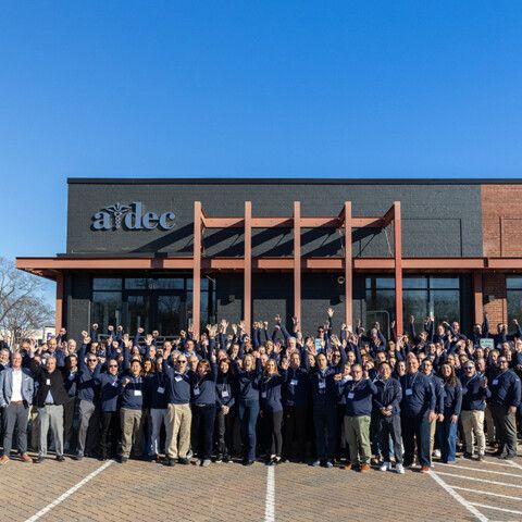 Benco and A-dec associates gather outside the A-dec Education Center to commemorate the partnership;