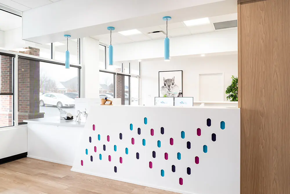 Check-in charmer: “My favorite part of the office is the custom desk. We get compliments all the time,” Dr. Boukas says. 