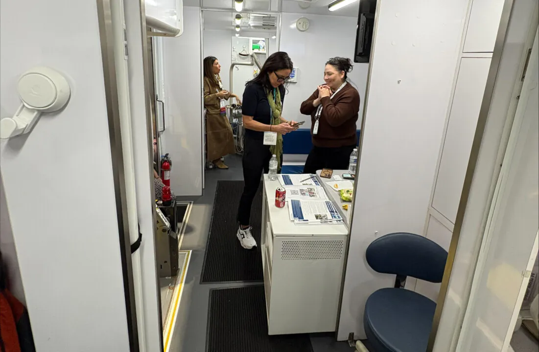 VAN WITH A PLAN: Amid the Chicago Dental Society Midwinter Meeting, territory representative Michele Geno (right) stepped into the Advocate Mobile Dental Van to support delivery of services to underserved communities throughout the greater Chicago area. 