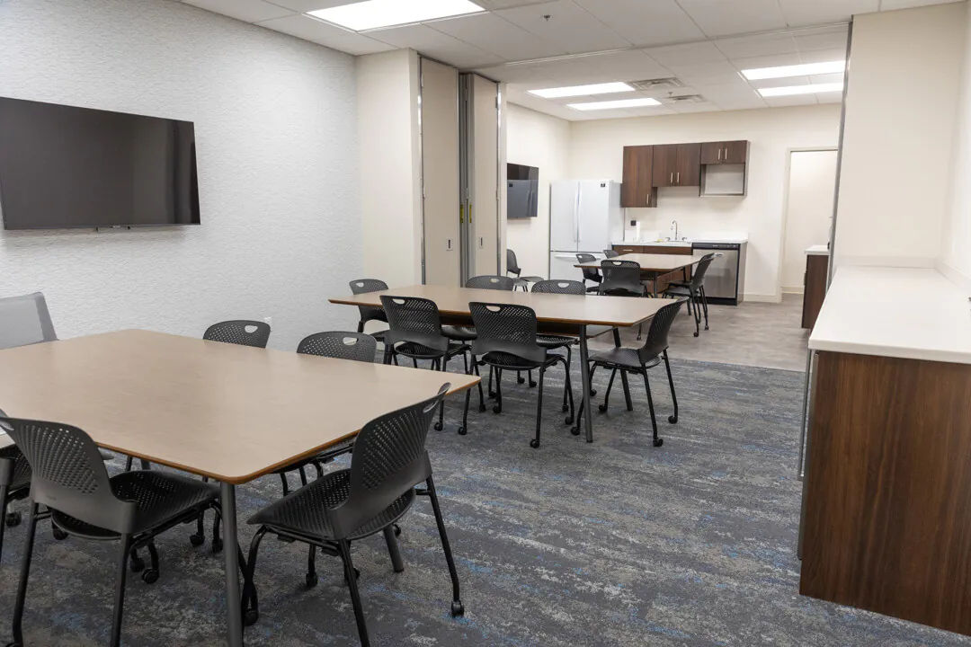 Divide and conquer: A movable divider can be opened or closed to combine the team and conference rooms into one large space for hosting bigger meetings. 