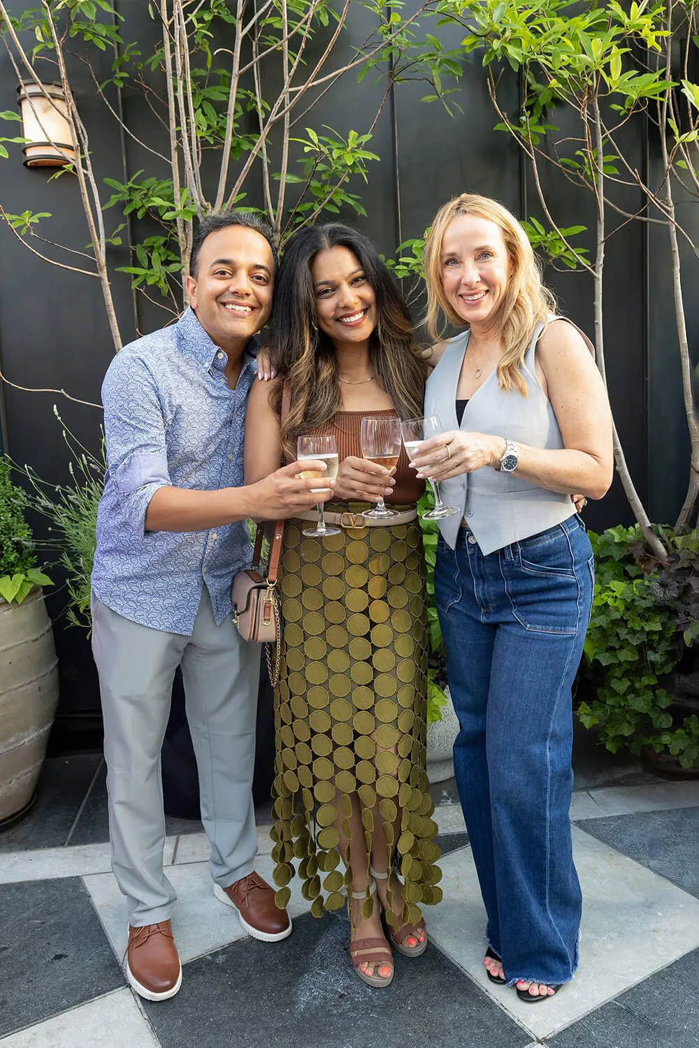 (4) 4040 Dr. Khushbu Shah Parikh (middle) with her husband, Dr. Neil Parikh, and Spear Education board member Stephenie Goddard;